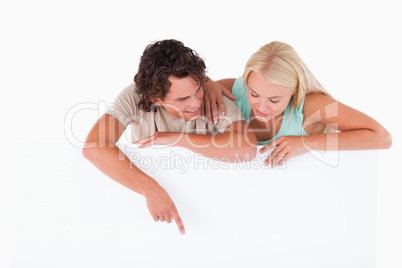 Handsome Man pointing on a whiteboard