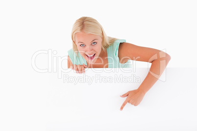 Joyful woman pointing at a whiteboard