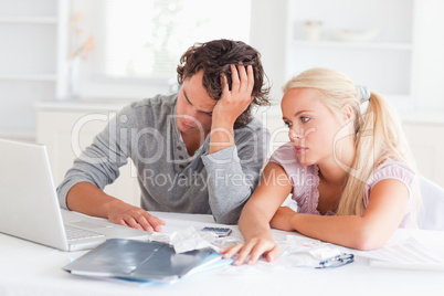 Worn out couple doing their accounting