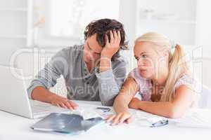 Worn out couple doing their accounting