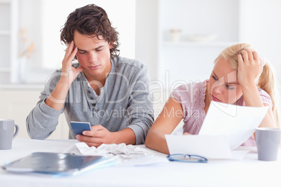 Couple going through their expenses