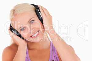 Cute woman listening to music