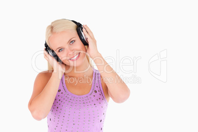 Cute blond woman with earphones