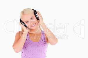 Cute blond woman with earphones
