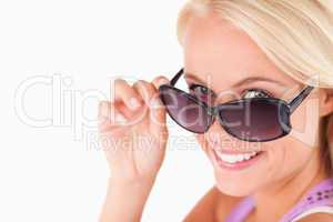 Cute lady peeking over her sunglasses