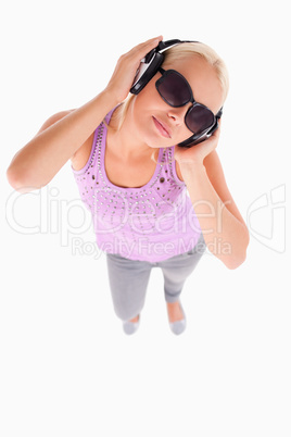 Glorious lady with sunglasses and earphones