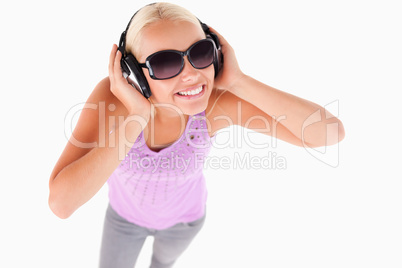 Cute lady with sunglasses and earphones