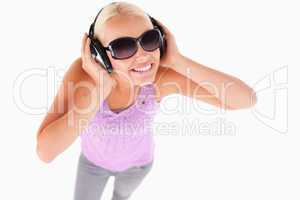 Cute lady with sunglasses and earphones