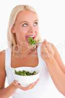 Charming woman eating salad