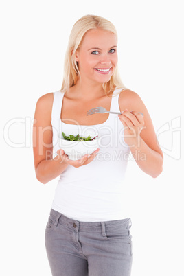 Charming lady eating salad