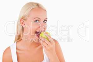 Cute woman eating an apple