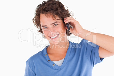 Handsome dark-haired guy on the phone