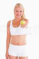 Cute woman holding an apple