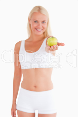 Glorious young woman holding an apple