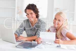 Confident couple accounting