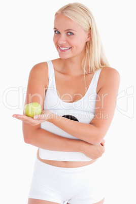 Woman holding an apple and a scale