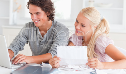 Happy couple doing paperwork