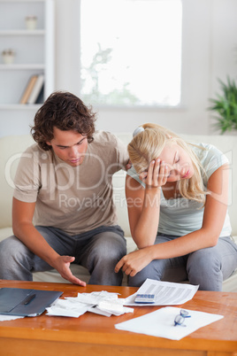 Stressed couple on a sofa