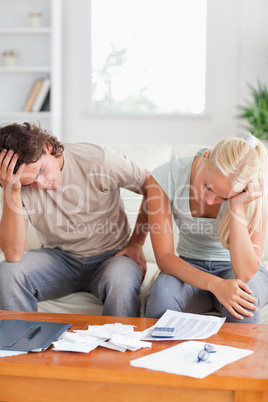 Unhappy couple on a sofa