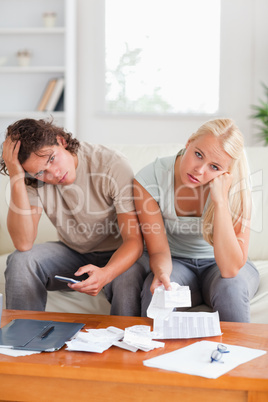 Worn out couple looking into the camera