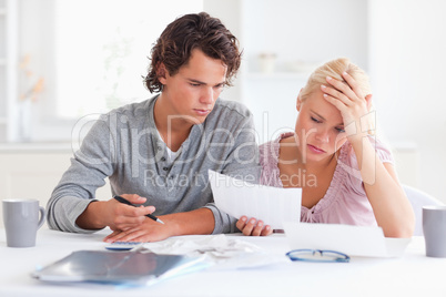 Worn out couple listing expenses