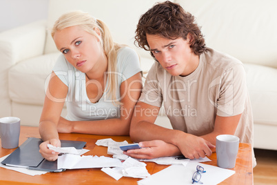 Unhappy couple looking into the camera