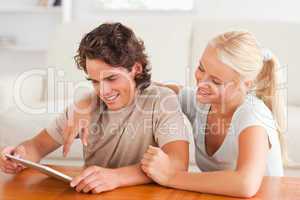 Cute couple with a tablet