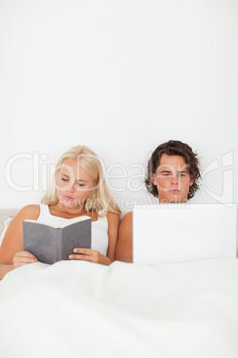 Portrait of a couple in their bed