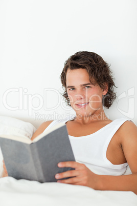 Portrait of a man holding a book