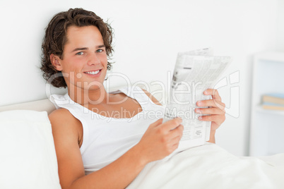Man holding a newspaper