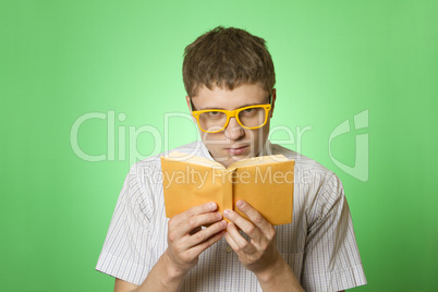 Young man bookworm reading