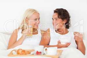 Smiling couple having breakfast