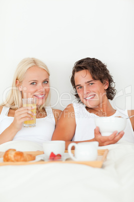 Portrait of a beautiful couple having breakfast