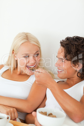 Portrait of a happy couple eating breakfast