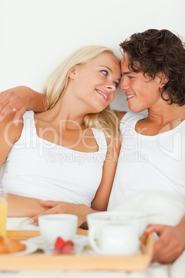 Portrait of cute couple eating breakfast