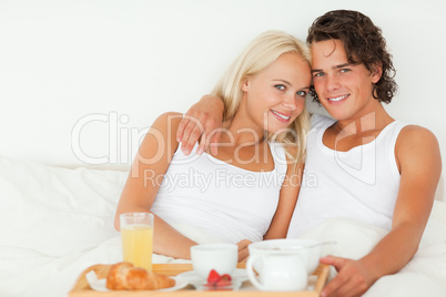 Lovely couple eating breakfast