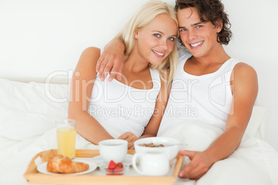 Young couple eating breakfast