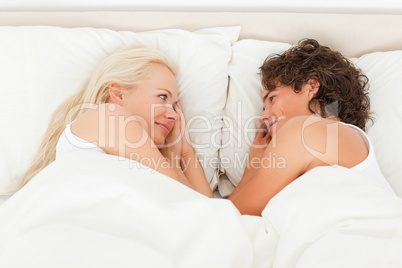 Couple lying while looking at each other