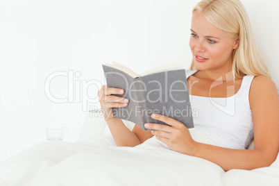 Gorgeous woman holding a book