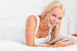 Smiling woman with a tablet computer