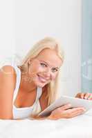 Portrait of a smiling woman with a tablet computer
