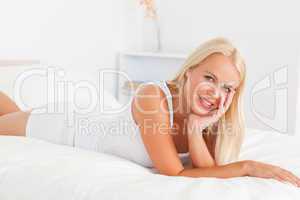 Cute woman posing on her bed