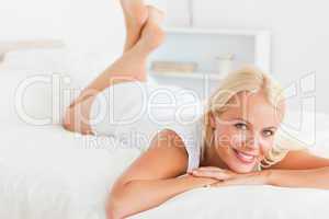 Cute woman lying on her bed