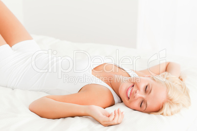 Smiling woman lying on her back