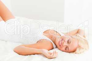 Smiling woman lying on her back