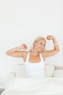 Portrait of a woman stretching her arms