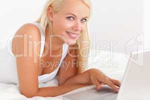 Close up of a woman with a laptop