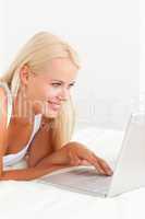 Portrait of a serene woman using a laptop