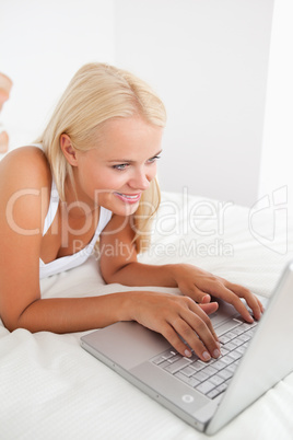 Portrait of a gorgeous woman using a laptop