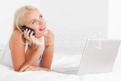 Woman on the phone with a laptop